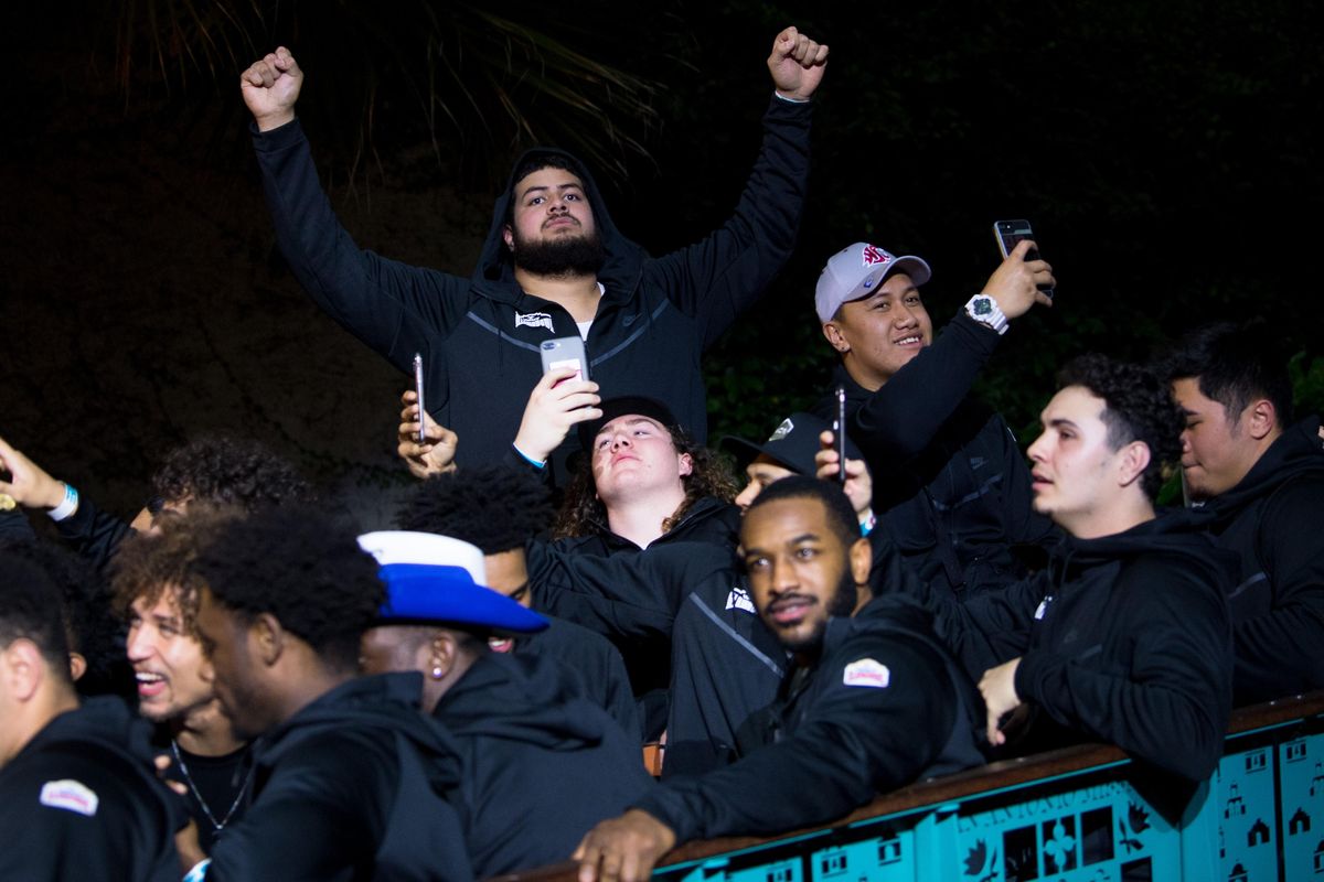 WSU players gesture to fans during the Alamo Bowl Rudy