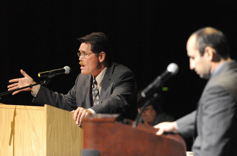 City Council candidates Mike Fagan, left, and Randy Ramos, right, debate at the candidate debates held by the Chase Youth Commission Wednesday, Oct. 7, 2015 at North Central High School. (Jesse Tinsley / The Spokesman-Review)
