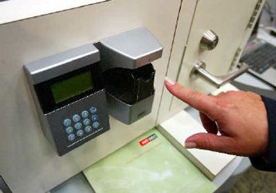 
Hitachi shows off its Finger-Vein Authentication system used for vehicle security at the Techworld 2005 show at the General Motors Technical Center in Warren, Mich.  
 (Associated Press / The Spokesman-Review)