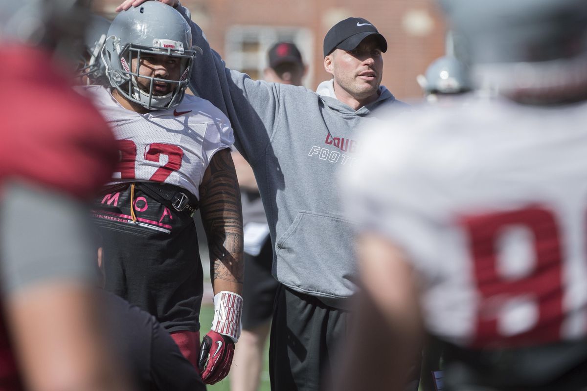 WSU defensive coordinator Alex Grinch coaches up his players on Thursday, March 31, 2016, at Martin Stadium in Pullman, Wash.  TYLER TJOMSLAND tylert@spokesman.com (Tyler Tjomsland / The Spokesman-Review)