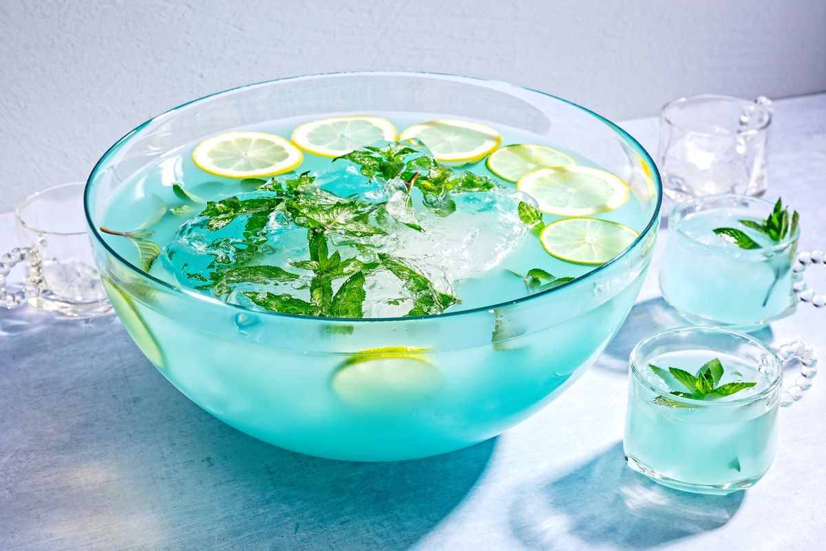 Blue curaçao makes a comeback in this Island Breeze Blue Punch.  (Scott Suchman for The Washington Post/food styling by Lisa Cherkasky for The Washington Post)