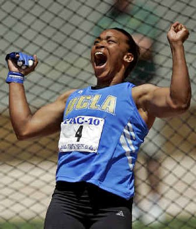 UCLA's Jessica Cosby celebrates after throwing the hammer 216 feet,10 inches – new meet record at UCLA's Drake Stadium.
(Associated Press / The Spokesman-Review)