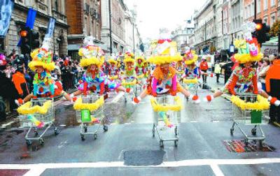 
The Red Hot Mamas were invited to perform in London's New Year's Day celebration in 2004 by the Lord Mayor of Westminster. From left are Debbie Bollinger, Becky Lassiter, Mikki Stevens and Candace Deaton. Below, Mikkie Stevens marches in a parade.
 (Photos courtesy of Mikki Stevens / The Spokesman-Review)