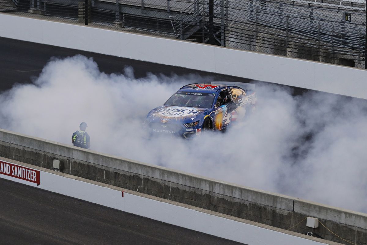 Kevin Harvick does a burnout after winning the NASCAR Cup Series auto race at Indianapolis Motor Speedway in Indianapolis, Sunday, July 5, 2020.  (Darron Cummings)