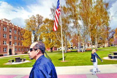 
Bob Cepeda, associate director of public safety and security at Gonzaga University, walks the campus Friday during a routine patrol. 
 (Photos by Brian Plonka / The Spokesman-Review)
