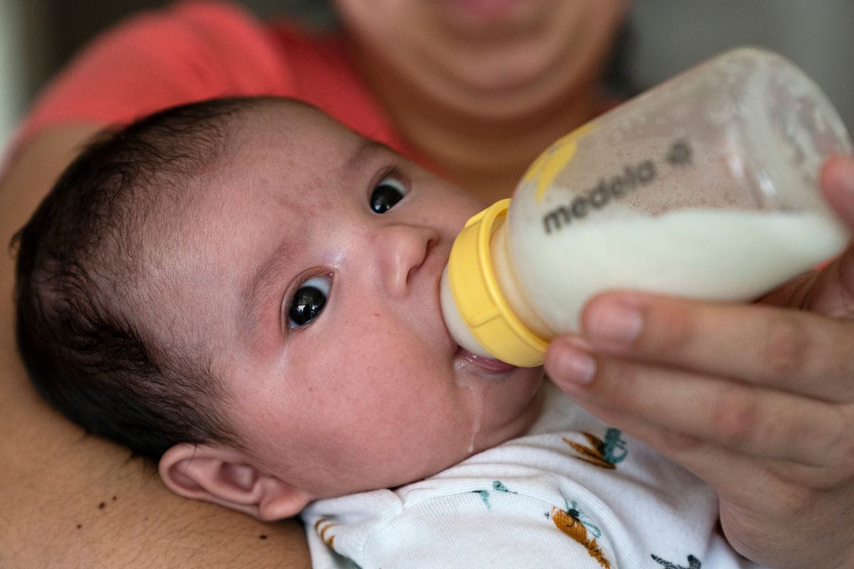 Two-month-old Jose Ismael Gálvez is fed a bottle of formula by his mother, Yury Navas, 29, of Laurel, Md., from her dwindling supply of formula at their apartment in Laurel, Md., Monday, May 23, 2022. After this day