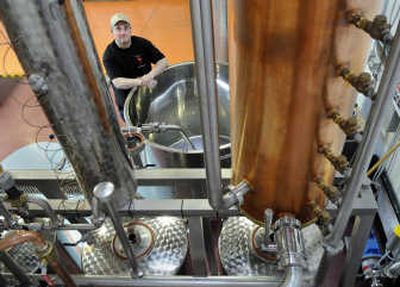 
Don Poffenroth, owner of Spokane's Dry Fly Distillery, is working with state Sen. Chris Marr to cut business fees for  small distilleries.
 (Dan Pelle / The Spokesman-Review)