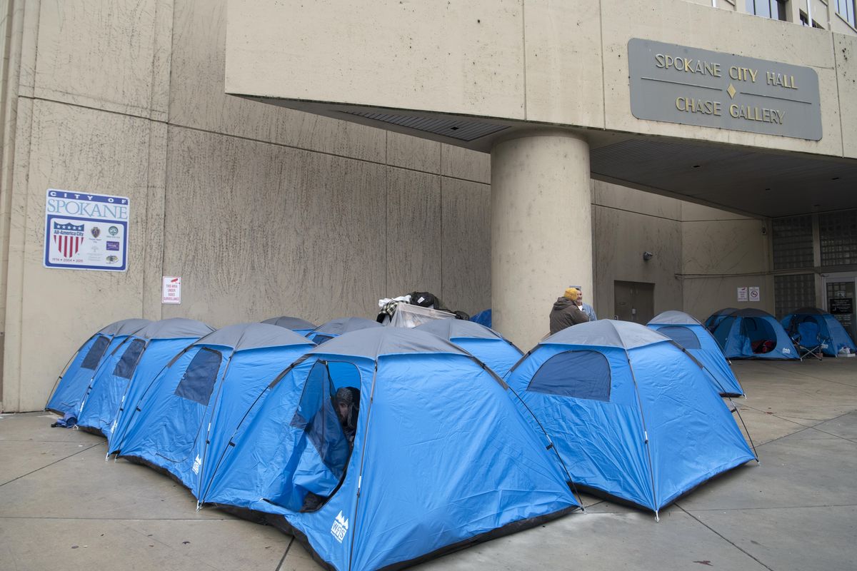 A homeless protest has spawned a tent city at Spokane City Hall Wednesday, on Nov. 28, 2018. A cash donation, and a discount from The General Store, allowed the homeless encampment to buy tents to place in the entryway of City Hall in Spokane. (Jesse Tinsley / The Spokesman-Review)