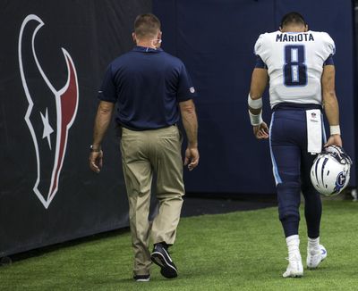 Tennessee Titans quarterback Marcus Mariota (8) walks off the field after suffering a hamstring injury during the third quarter of an NFL football game against the Houston Texans at NRG Stadium on Sunday, Oct. 1, 2017, in Houston. (Brett Coomer / Houston Chronicle via AP)