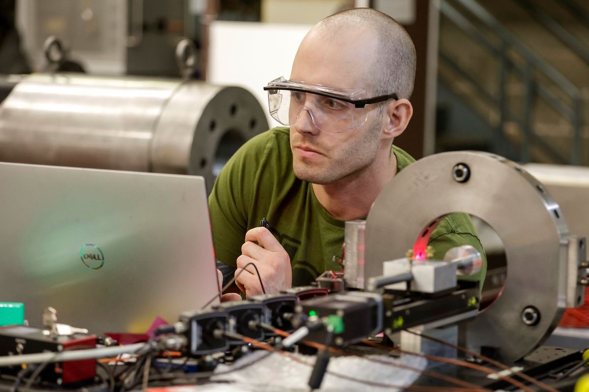 Eric Jackson calibrates a velocity block for a gas gun at the WSU Institute for Shock Physics on Tuesday in Pullman. (Geoff Crimmins/For The Spokesman-Review)