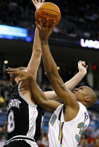 
New Orleans forward David West, right, shoots as San Antonio center Rasho Nesterovic defends.
 (Associated Press / The Spokesman-Review)