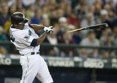 
Seattle Mariners' Jose Guillen shatters his bat on a two-run RBI single to center field in the second inning Sunday. Associated Press
 (Associated Press / The Spokesman-Review)