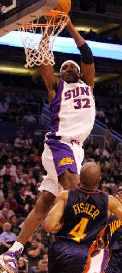 Phoenix Suns' Amare Stoudemire gets a shot off between