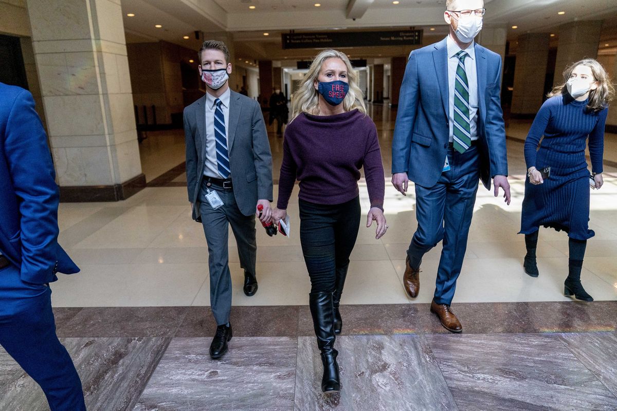 Freshman Rep. Marjorie Taylor Greene, R-Ga., a conspiracy theorist with a long history of violent rhetoric, walks back to her office after speaking Thursday on the floor of the House Chamber on Capitol Hill in Washington.  (Andrew Harnik)