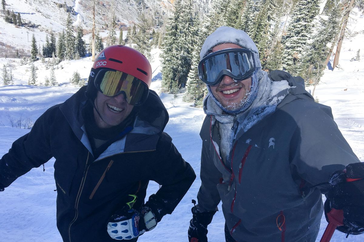 The author, Eli Francovich, right, stands covered in snow after skiing down a cliff with his cousin, former Olympian Marco Sullivan, on Feb. 23. (Anna Goodman / Courtesy)