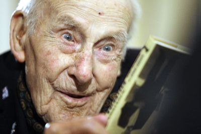 Henry Allingham, then 112, holds a copy of his book at a launch in London on Sept. 23, 2008.  (Associated Press / The Spokesman-Review)