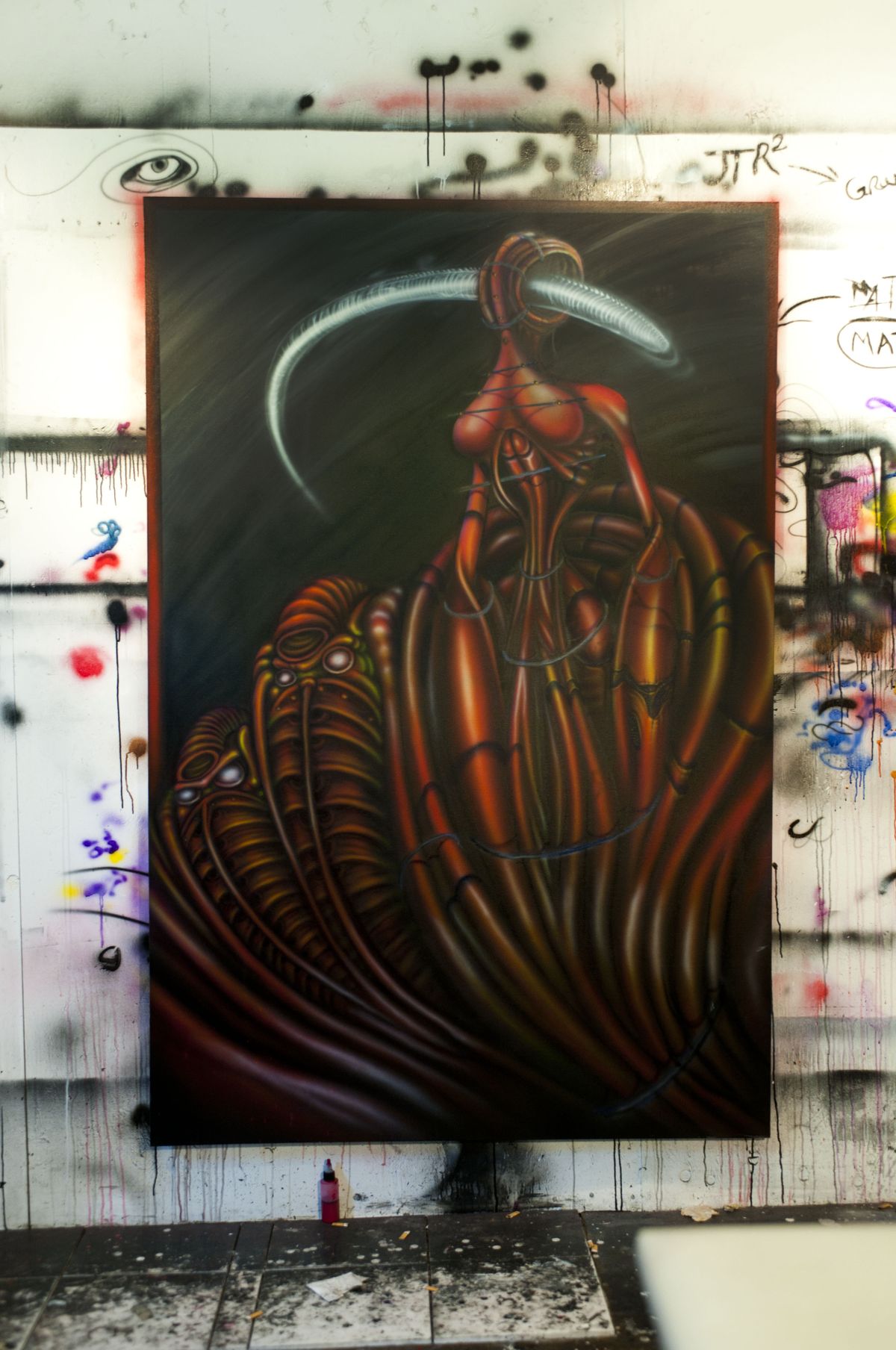 An airbrushed painting in progress is shown in Jason Goldberry’s studio at his West Central home.