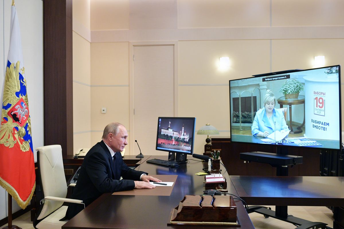 Russian President Vladimir Putin speaks to Ella Pamfilova, head of Russian Central Election Commission, on the screen, during their meeting via video conference at the Novo-Ogaryovo residence outside Moscow, Russia, Monday, Sept. 20, 2021.  (Alexei Druzhinin)