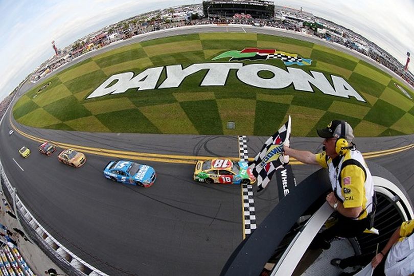 Kyle Busch, driver of the #18 M&M's Toyota, crosses the finish line to take the checkered flag to win the NASCAR Sprint Cup Series Budweiser Duel 2 at Daytona International Speedway on February 21, 2013 in Daytona Beach, Florida. (Photo by Tom Pennington/NASCAR via Getty Images) (Tom Pennington / Nascar)