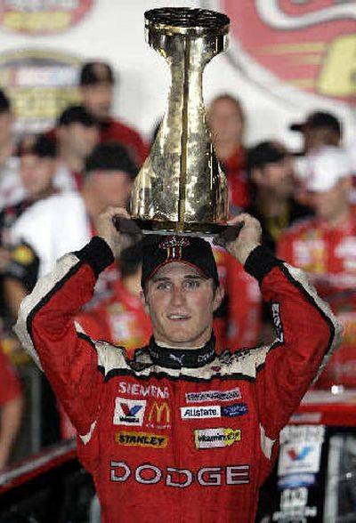 
Kasey Kahne balances the trophy on his head after winning the Coca-Cola 600. 
 (Associated Press / The Spokesman-Review)