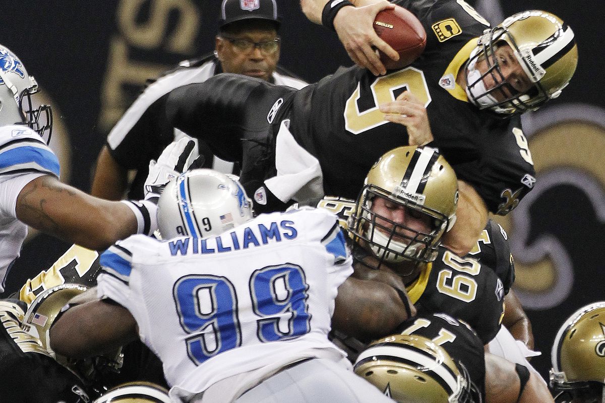 Saints quarterback Drew Brees dives over the line for a first down during the second half. (Associated Press)
