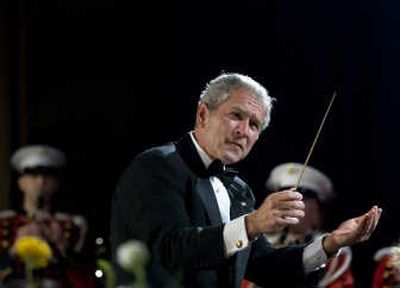 President Bush conducts the United States Marine Corps Band on Saturday in Washington. Associated Press
(Associated Press / The Spokesman-Review)