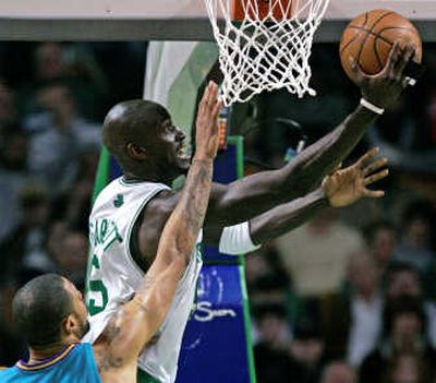 
Boston's Kevin Garnett goes up for a shot in front of Tyson Chandler of New Orleans.Associated Press
 (Associated Press / The Spokesman-Review)