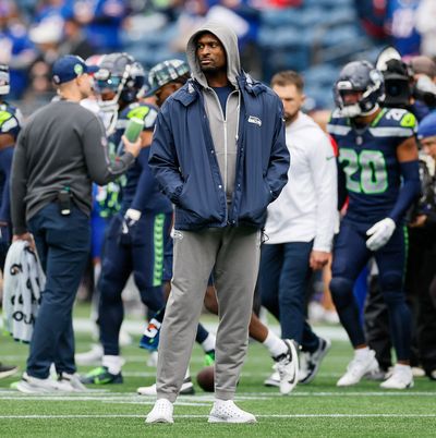 Seattle Seahawks wide receiver DK Metcalf watches warm-ups in street clothes before the start of a game against the Buffalo Bills Sunday, Oct. 27, 2024, at Lumen Field in Seattle.  (Jennifer Buchanan/Seattle Times)