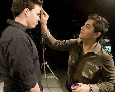 Marcos Najera, station manager for a Phoenix cable television channel, applies makeup to Casey Thorne before Thorne goes on camera for a recent broadcast in Phoenix. Najera, 33, says he wishes members of the baby boomer generation were more willing to be mentors for young adults.
(Associated Press / The Spokesman-Review)