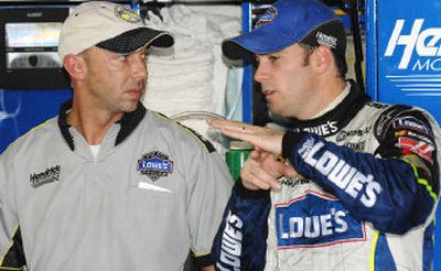NASCAR Nextel Cup points leader Jimmie Johnson, right, talks with crew chief Chad Knaus on Friday at Loudon, N.H.
(Associated Press / The Spokesman-Review)