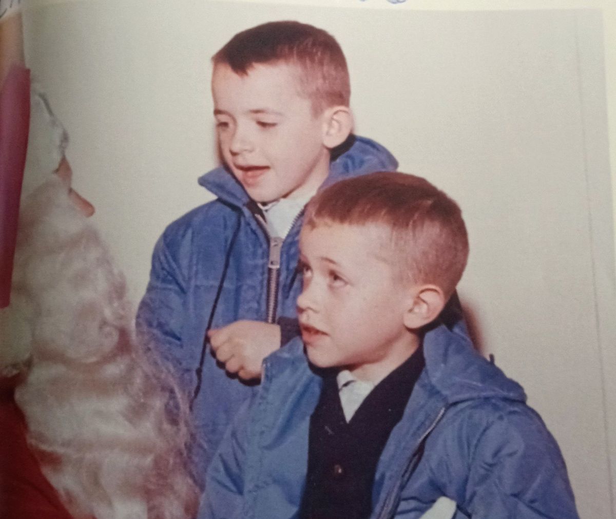 James Feehan sits on Santa’s lap, while older brother John looks on during Christmas 1963 at the Crescent in downtown Spokane. (Courtesy of James Feehan)