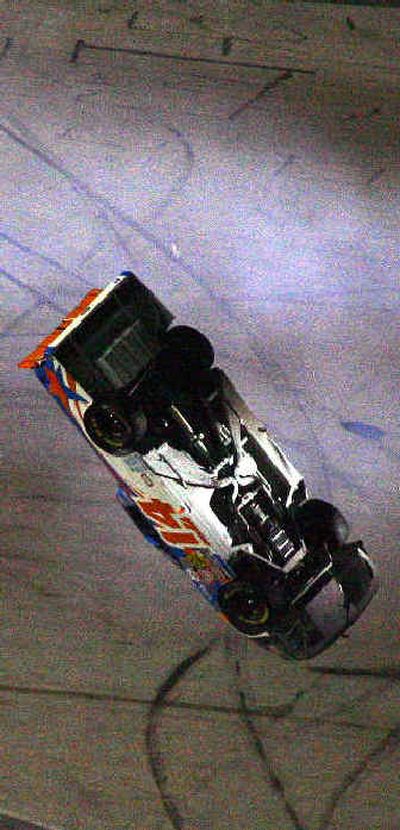 
Driver Rick Crawford flips his truck through the tri-oval during the Florida Dodge Dealers 250. 
 (Associated Press / The Spokesman-Review)
