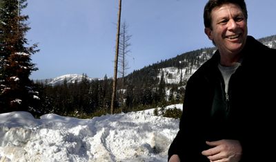 Marc Kroetch, a member of Spirit Lake Parks and Recreation Commission, is shown in Spirit Lake with Mount Spokane in the background on Thursday. Kroetch hopes to market a designated trail from Mount Spokane, through Washington and Idaho,  into downtown Spirit Lake.  (Kathy Plonka / The Spokesman-Review)