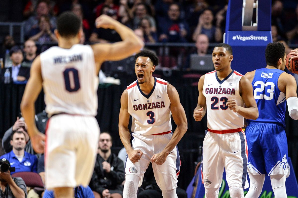 After drawing a foul on BYU, Gonzaga’s Johnathan Williams, center, celebrates with teammates Silas Melsonand Zach Norvell Jr. during the 2018 WCC Tournament in Las Vegas.  (By Dan Pelle/The Spokesman-Review)