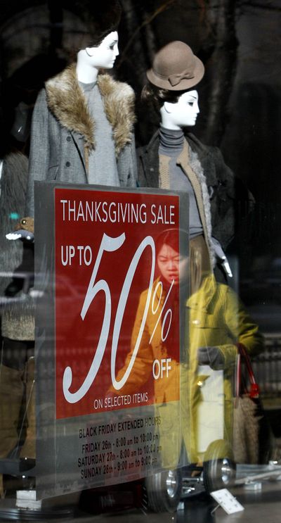  A shopper is reflected in the window at the Zara women’s apparel store on Chicago’s Magnificent Mile last month. Retail sales rose for a fifth straight month in November as the biggest jump in department store sales in two years got the holiday shopping season off to a jolly start.  (Associated Press)
