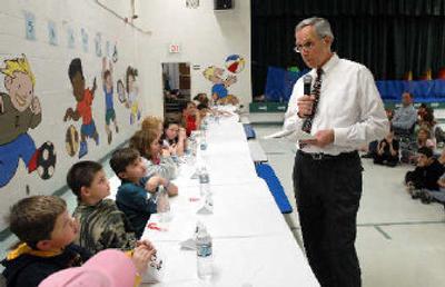 
Bob Turner quizzes fourth- and fifth-graders about countries, continents and cultures at a  geography bee  at Bryan Elementary. 
 (Jesse Tinsley / The Spokesman-Review)