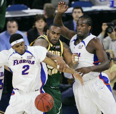 
Florida's Corey Brewer, left, and Chris Richard excel on defense. 
 (Associated Press / The Spokesman-Review)
