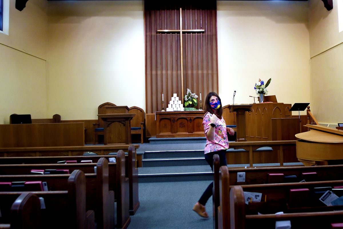 The Rev. Tiffany DeTienne gives a tour of Manito United Methodist Church while talking about the toilet paper fundraiser designed to help maintain the historic building in Spokane on Aug. 13. (Kathy Plonka/The Spokesman-Review)