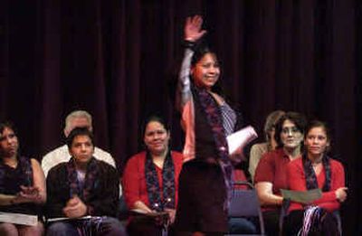 
Michelle Michael waves to the audience after receiving her certificate Wednesday at Spokane Community College. Michelle Michael waves to the audience after receiving her certificate Wednesday at Spokane Community College. 
 (Jed Conklin/Jed Conklin/ / The Spokesman-Review)