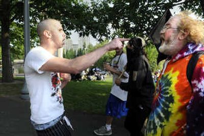 Benjamin Lasseigne, left, confronts Larry McAdams and other marchers Friday in Riverfront Park. 
 (Dan Pelle / The Spokesman-Review)