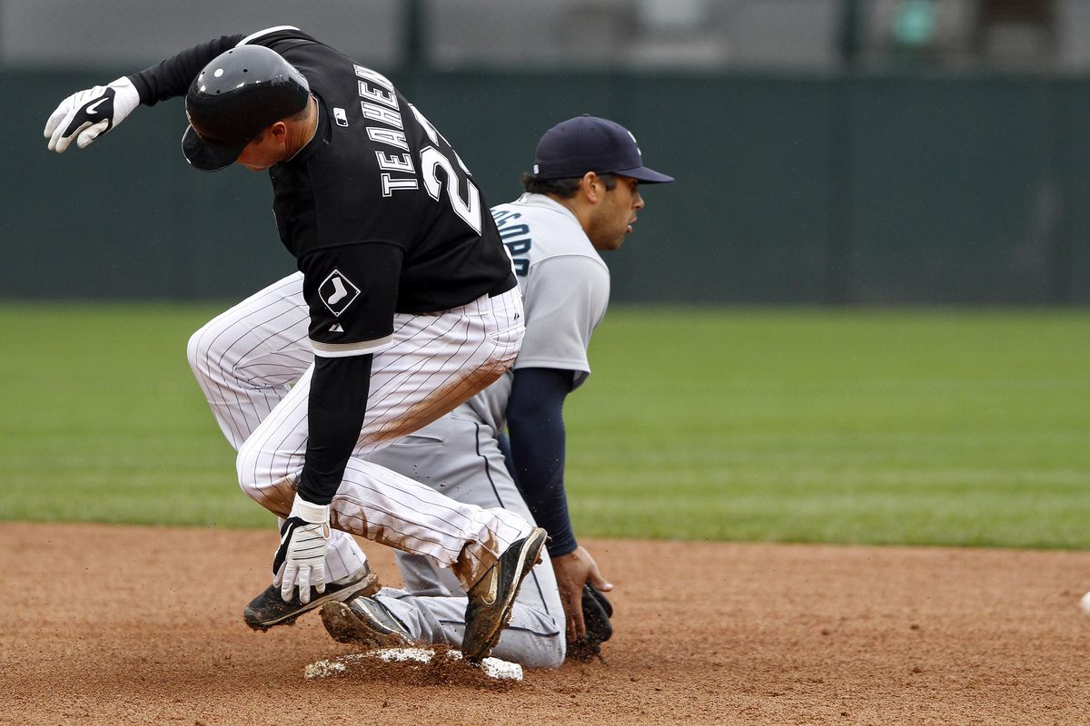 Chicago’s Mark Teahen is safe at second as Seattle’s Matt Tuiasosopo waits for the throw in the seventh inning. (Associated Press)