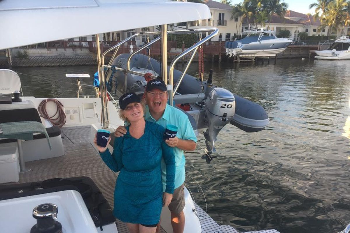 Kathy and Kent Meredith, longtime Spokane music teachers, pose on their 42-foot catamaran they call WindEnsemble. After recent retirement from teaching, the couple live on their boat year-round for sailing to such destinations as the Bahamas. (Courtesy)