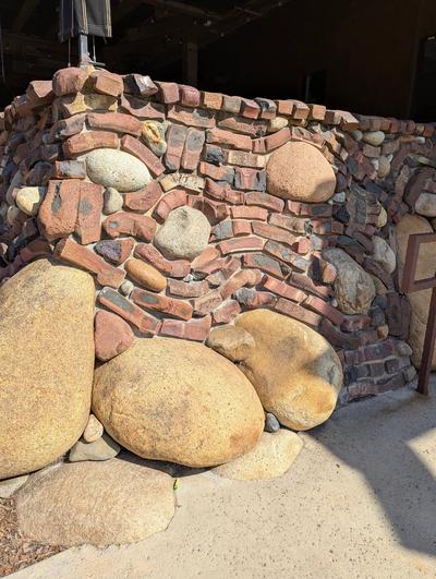 This is a small brick and stone retaining wall. The mason used some factory-reject bricks to create it. It’s also possible these curved and twisted bricks were made on purpose.  (Tribune Content Agency)