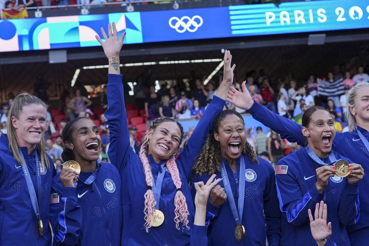 Members of the United States women’s soccer team celebrates after defeating Brazil in the Women’s Football gold medal match at Parc des Princes during the Paris 2024 Olympics on August 10, 2024.  (Washington Post)