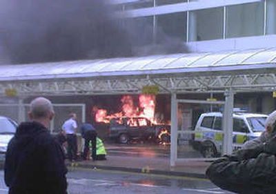 
Two men tried to ram a jeep, with flames pouring from it, into Glasgow Airport's main terminal Saturday in Scotland.Two people were arrested. Associated Press
 (Associated Press / The Spokesman-Review)
