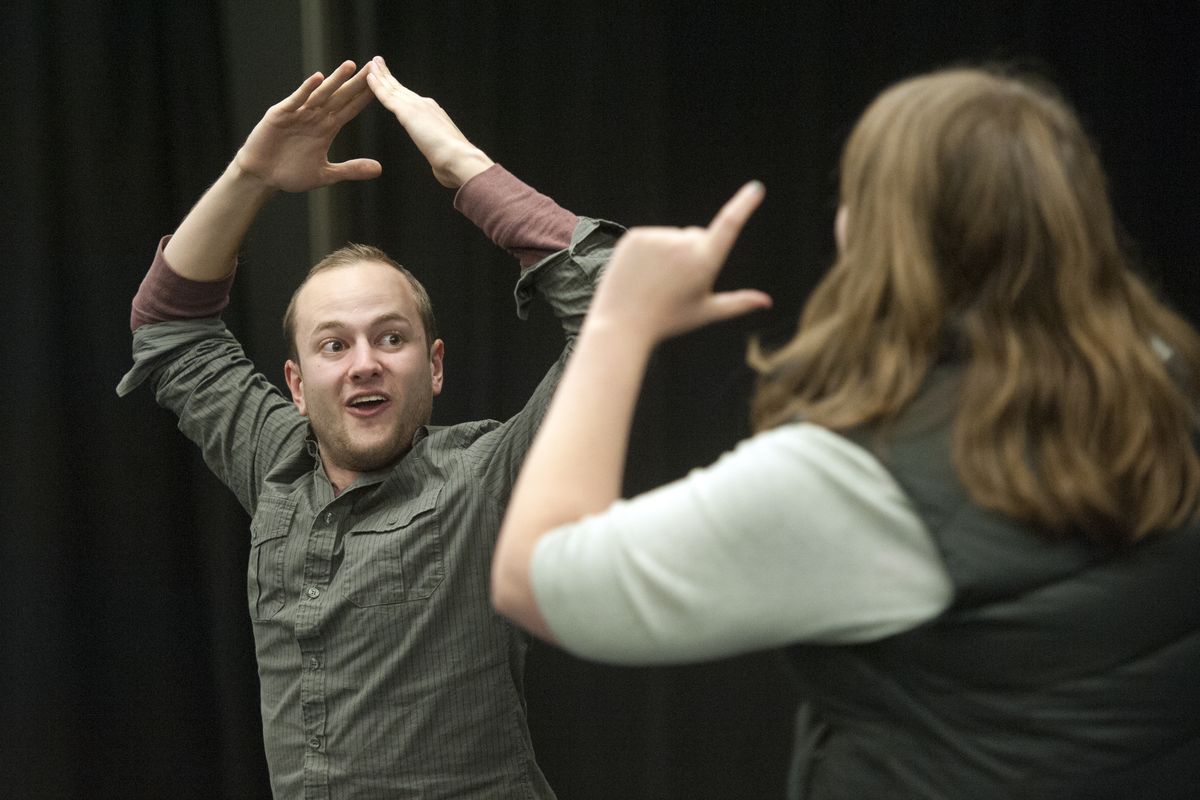 Caleb Drechsel, left, plays a pantomime game with Alyson King during rehearsals for Cool Whip, the improv comedy troupe based at Whitworth University on Nov. 6. (Jesse Tinsley)