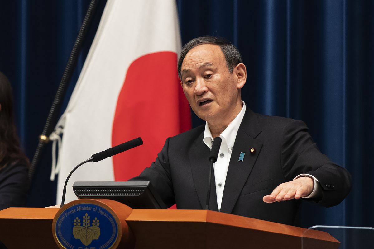 Japanese Prime Minister Yoshihide Suga responds to a reporter’s question after he spoke at a news conference in Tokyo on Friday, May 7, 2021. Suga announced an extension of a state of emergency in Tokyo and other areas through May 31.  (Hiro Komae)