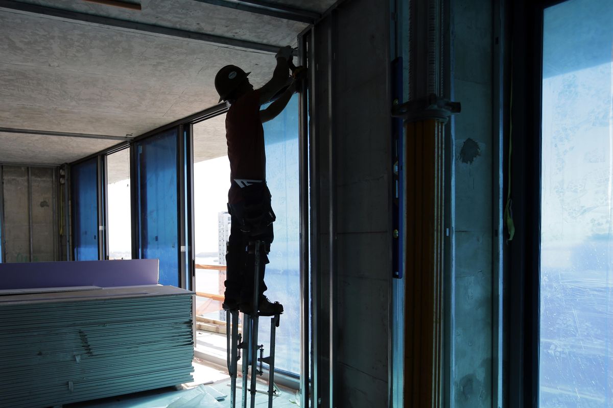 In this Thursday, Jan. 19, 2017, photo, a construction worker continues work at the SLS Lux in the Brickell neighborhood of Miami. The SLS LUX is a 57-story residential and hotel property developed by the Related Group, and is scheduled to open in 2017. Exactly eight years after the Great Recession ended, the U.S. job market has settled into a sweet spot of steadily solid growth. (AP Photo/Lynne Sladky) ORG XMIT: FLLS410 (Lynne Sladky / AP)