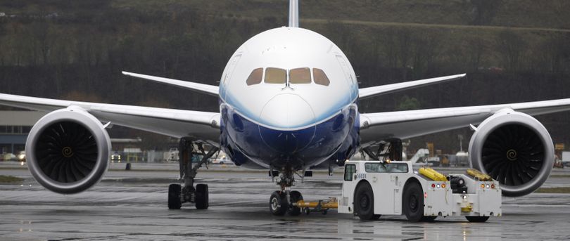 A Boeing Co. 787 airplane is towed to the tarmac after coming in for a landing at Boeing Field in Seattle. (Associated Press)