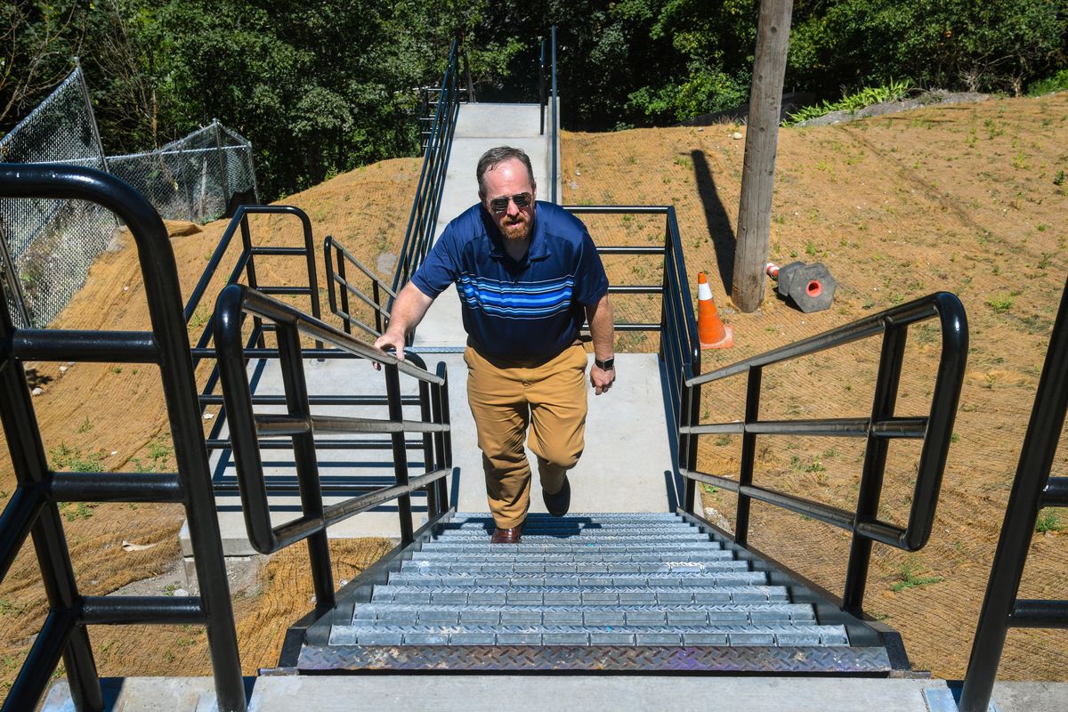 The staircase connecting Peaceful Valley to Riverside Avenue near its intersection with Cedar Street has reopened. Jason Brown gave the stairs a mid-day walk-through, Thursday, July 12, 2018. (Dan Pelle / The Spokesman-Review)